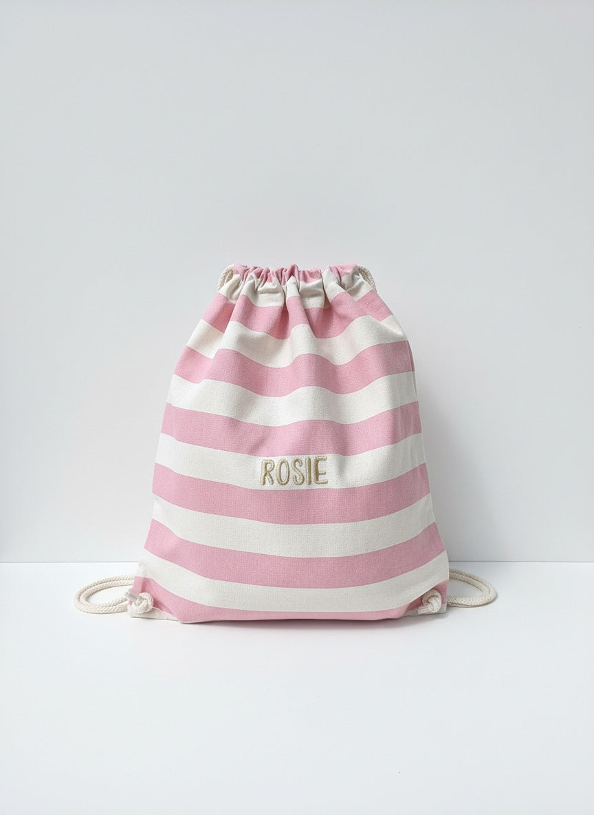 Roze gestreept turnzakje met stijlvol geborduurde naam in gouden letters